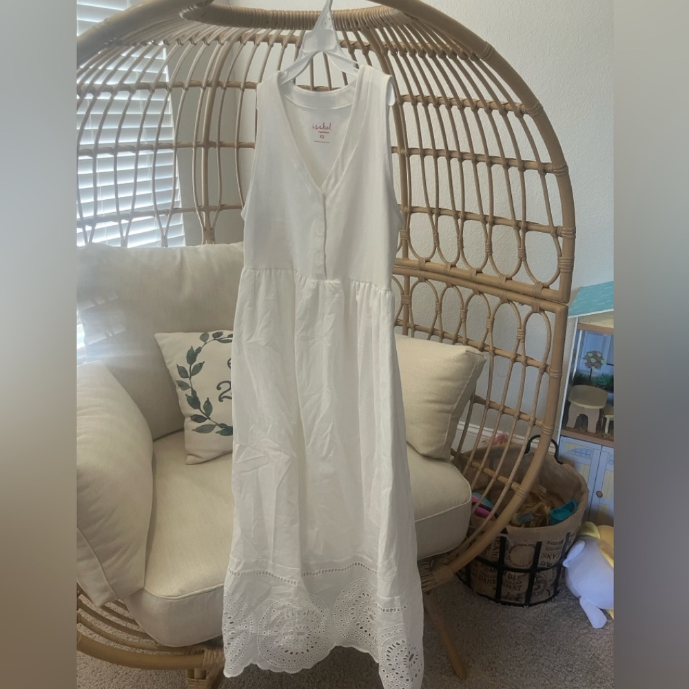 Maternity dress with white eyelet features